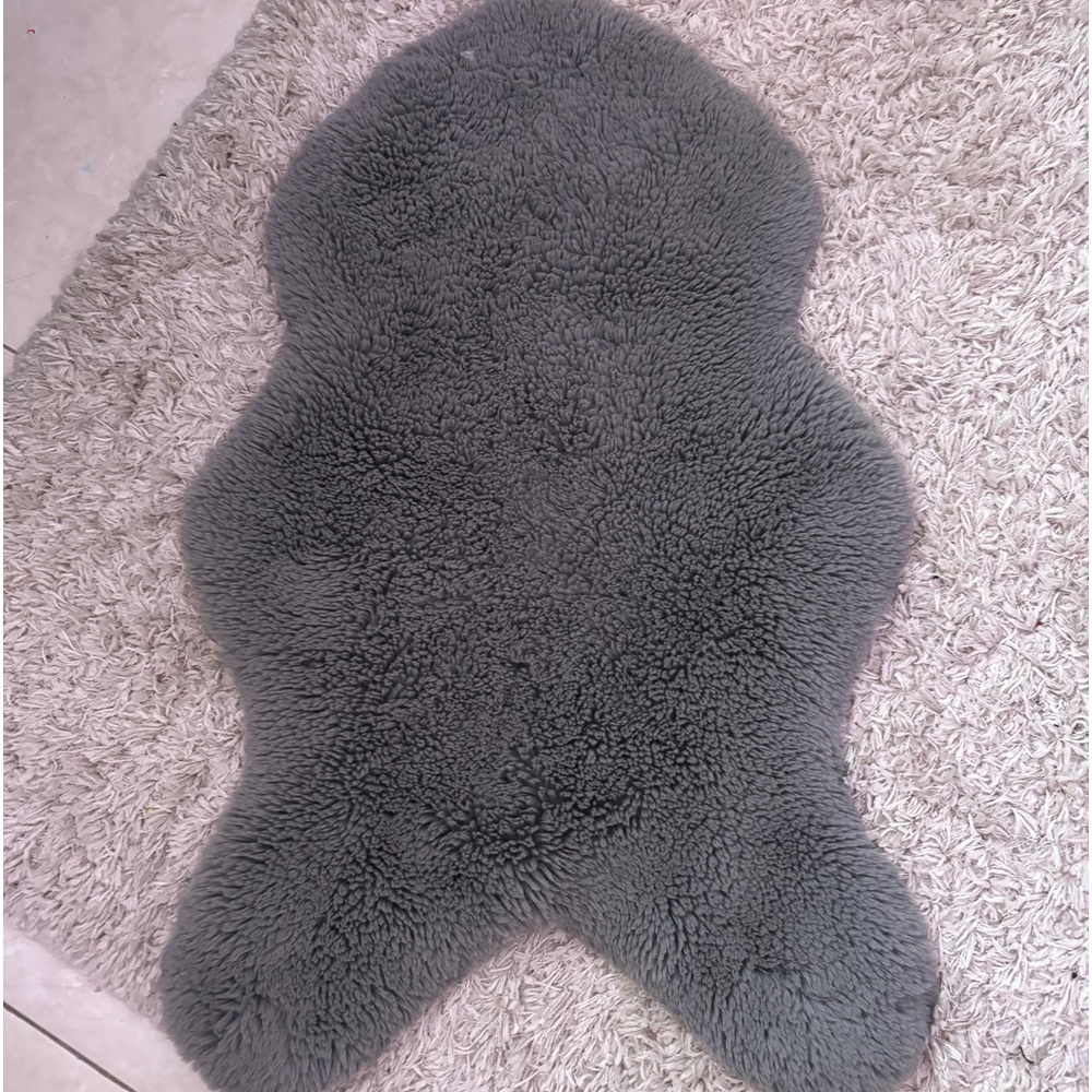 grey small cute shaped carpet for room